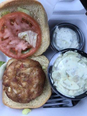 Crab cake sandwich with potato salad.