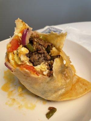 A monstruous breakfast burrito with sausage. Delicious.