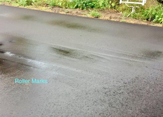 Roller Marks and some puddling makes it slippery in the winter.