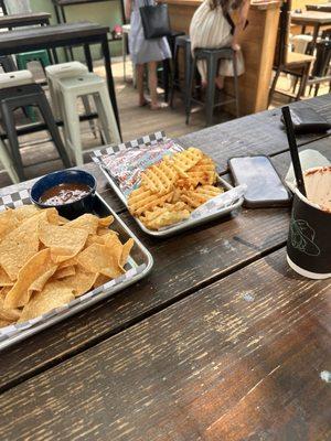 Chips and queso, smash burger, and prickly pear margarita