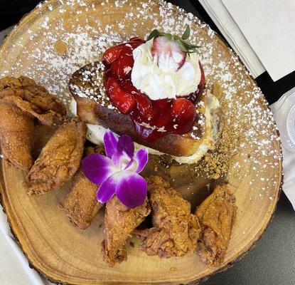 Stuffed strawberry French toast with a side of fried chicken wings