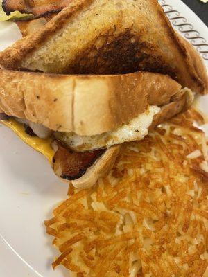 Bacon Egg Cheese Texas Melt. Hash browns.