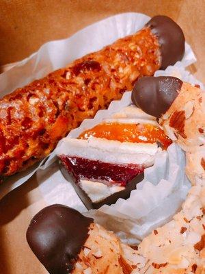 mocha filled marzipan, apricot and raspberry tart, and an almond chocolate horn