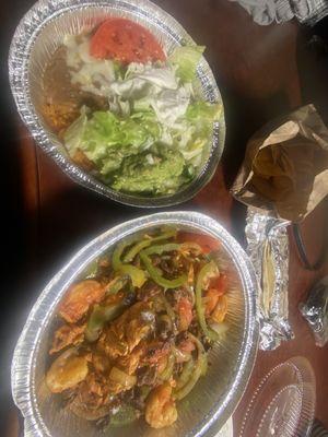 Fajitas Texanas and rice and beans with guacamole, sour cream, and fresh lettuce and tomatoes.  Delicious....