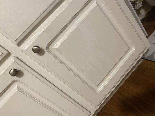 Stained and discolored cabinets they were supposed to paint before I moved in.