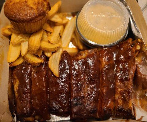 Rib plate with Mac and Cheese, Fries, and a Cornbread Muffin.