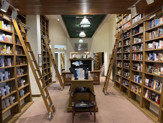 Ample walls of books  and love the ladders!