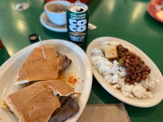 Bistec Sandwich with a side of rice and pink beans (with olives and potatoes).