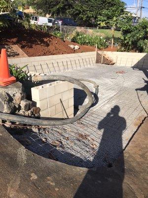 Retaining wall and concrete carport with steps (before)