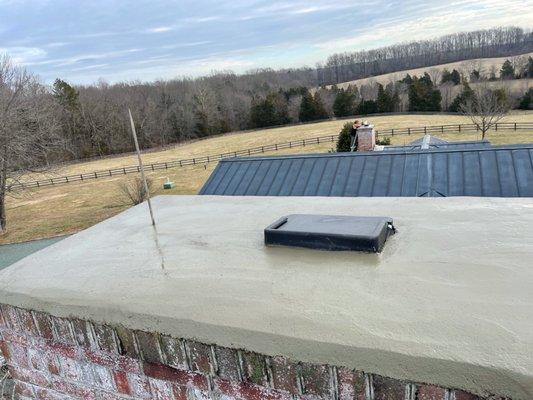 Chimney cap and new concrete installed on chimney