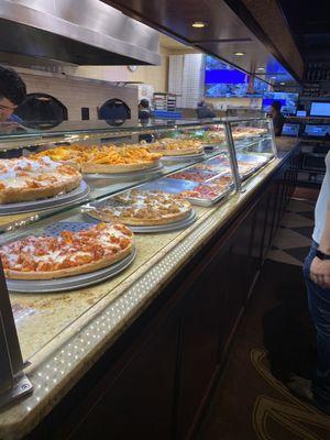 The portions and a sneak peak at the slices in the pizzeria at mamas.