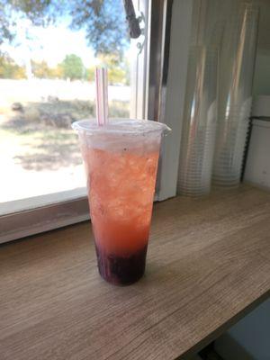 Large strawberry lemonade with blueberry bursting Boba pearls.