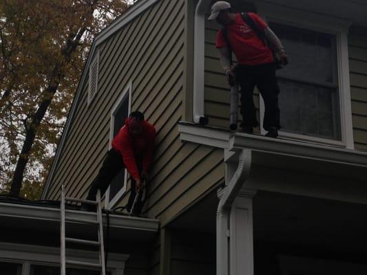 We do what the others don't! Blow the debris off the roof and flush the entire system.