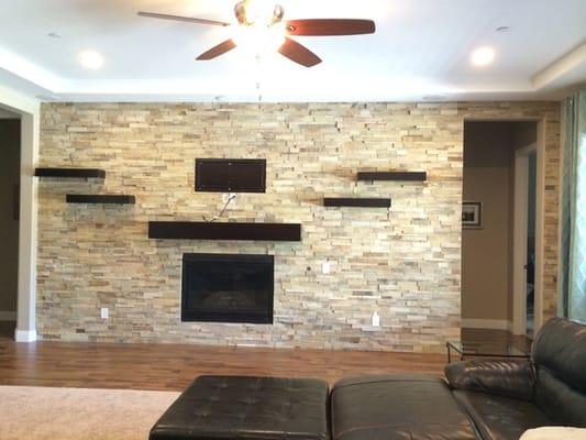 Here is a picture of the mantel and shelves that Oscar built.