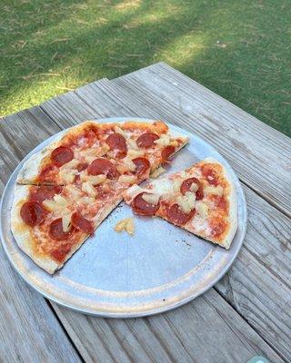 Pepperoni and pineapple pizza