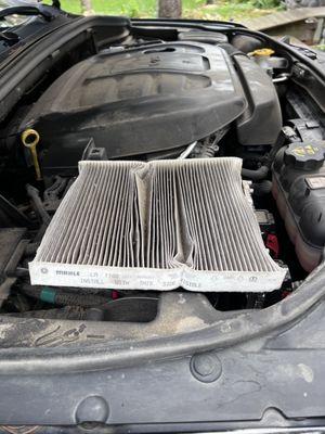 Filter was crushed and reinstalled incorrectly.  You cannot remove it from the engine compartment without doing this!