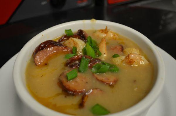 Charleston Style Shrimp and Grits – Sautéed Jumbo Shrimp and Sliced Andouille Sausage in Brown Gravy over Creamy Grits Topped with Scallions