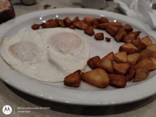 Eggs over easy& fried potatoes