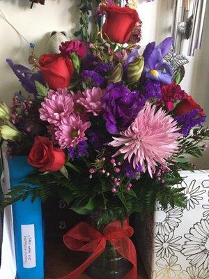 My sisters beautiful roses surrounded by her favorite color, purple.