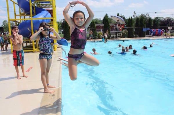 A refreshing leap into the pool!