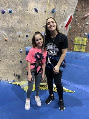 Staff members assisting climbers during birthday party.