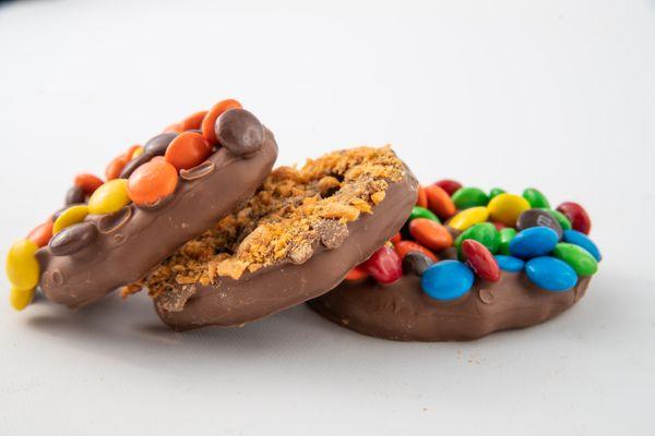 Sweet treats, chocolate dipped pretzels with toppings of your choice