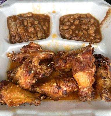 Awesome wings with a side of baked beans.