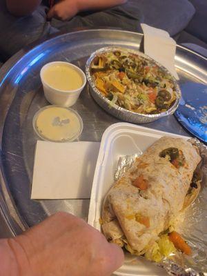 A HUGE vegi burrito, Vegi nachos, & a side order of white cheese.