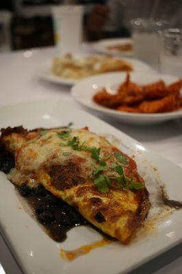 The Hombre Three egg omelette with black beans, fresh house made salsa, Monterey Jack cheese and chorizo sausage.