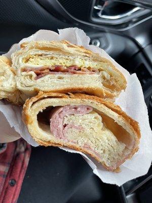 Egg, bacon and cheese and a ham & cheese croissant