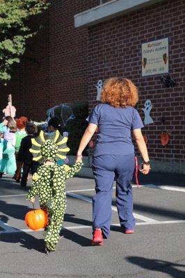 My son holding Miss Lupe's hand during the Halloween Parade :)