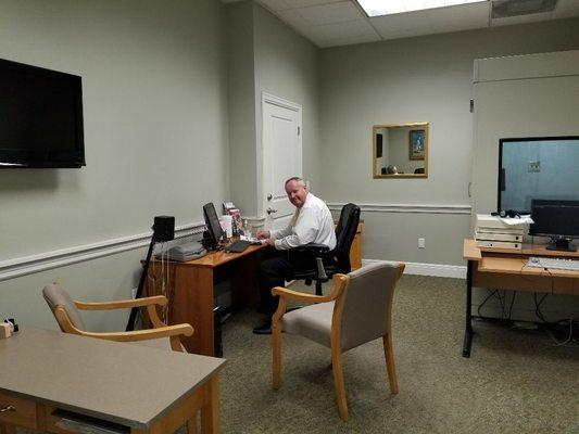 Dr. Young in his testing and fitting room.  Spending the time necessary to fully understand your individual hearing challenges.