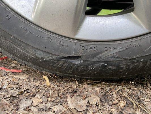 The gouge in the front passenger tire they saw but didn't think was relevant to the front passenger side collision.