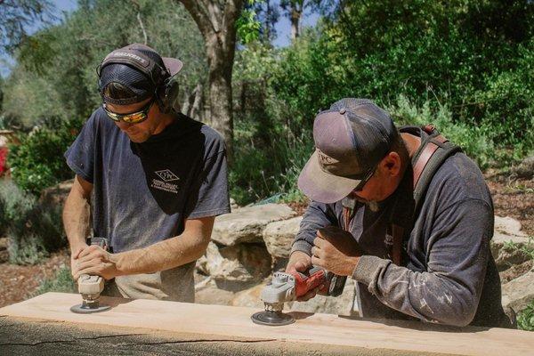 The crew prepping and installing a piece of reclaimed wood in this beautiful home in Rancho Santa Fe!