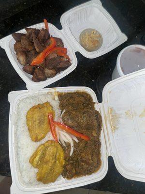 Legume and Fried Pork (Griot) with white rice and beans.