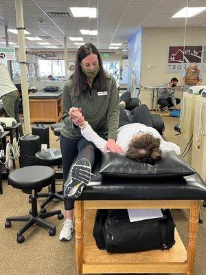 Jeanine Seewald PTA treats her patients arm.