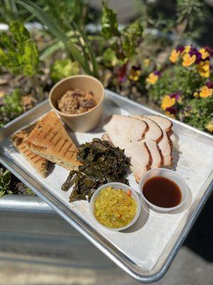 Smoked turkey breast with two sides, chow chow, and cornbread