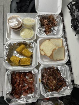 Brisket, ribs, and sausage + potatoe salad, beans, corn