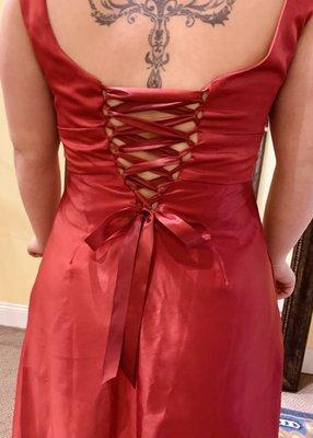 She needed her dress let out, so we added a beautiful corset.