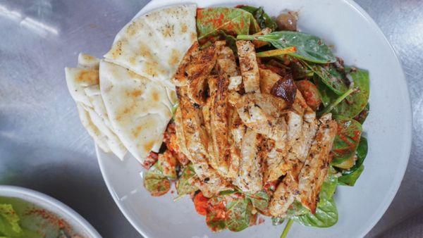 Spinach grain bowl with grilled chicken