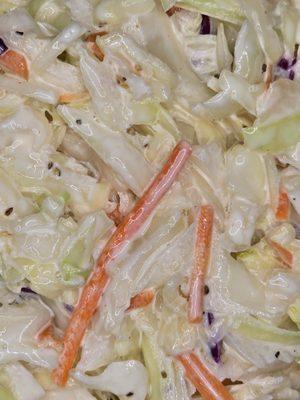 Our coleslaw brings the crunch and the flavor--creamy, zesty, and the perfect sidekick to all that smoky BBQ goodness.