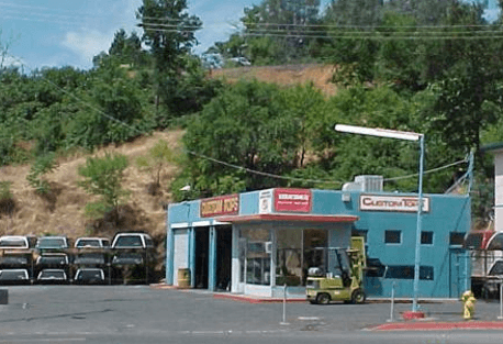 Pic of converted gas station into "Custom Tops" sales/service/repair Camper top business