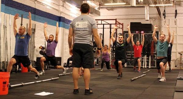 Coach Chris leading the 5p group class through some technique drills during the warm-up!