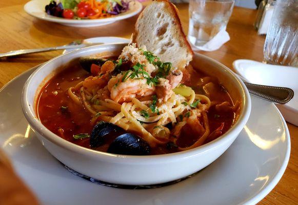 Seafood Cioppino with pasta. An excellent choice for seafood lovers. Good broth and plenty of seafood ingredients.  Pasta and crab is extra.