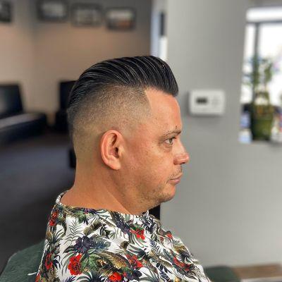 Skin fade pomp, styled with Simply Traditional Matte Paste and a touch of hair spray.