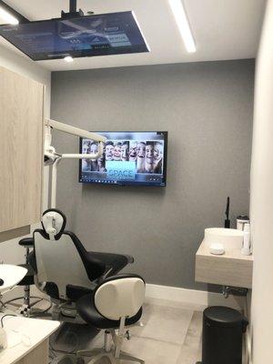 Treatment room with TV in the ceiling.