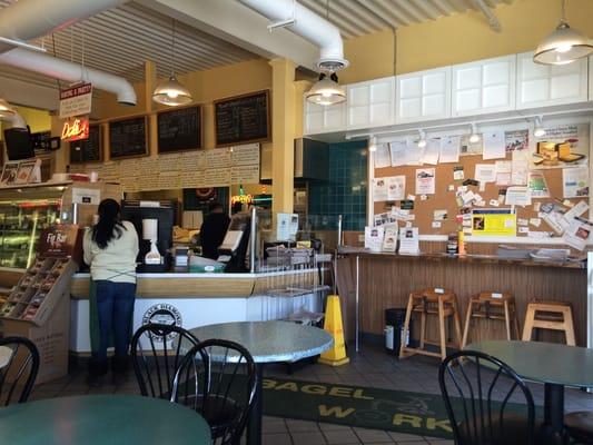 Peruse the community bulletin board while you wait for your delicious bagel.