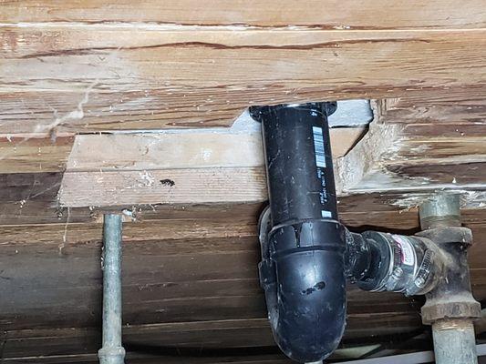 cut a larger hole by the drain pipe? told not to worry about not having caulking because shower pan would prevent water and mold in walls