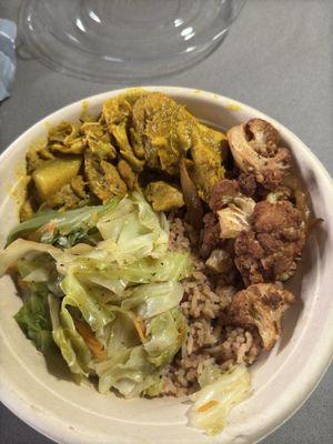 To-go bowl. Rice & Peas, cabbage, curry chicken, jerk cauliflower