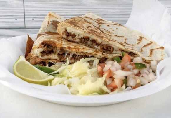 12 inch Quesadilla with any choice of meat and on the side a lettuce ,pico de gallo, avocado,sourcream and limes